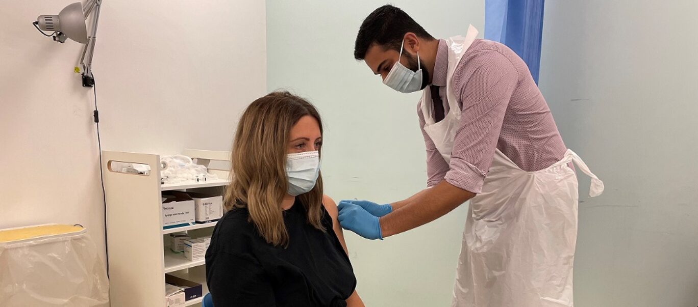 Laura Kennedy getting both her COVID-19 autumn booster and flu vaccine at her local pharmacy.