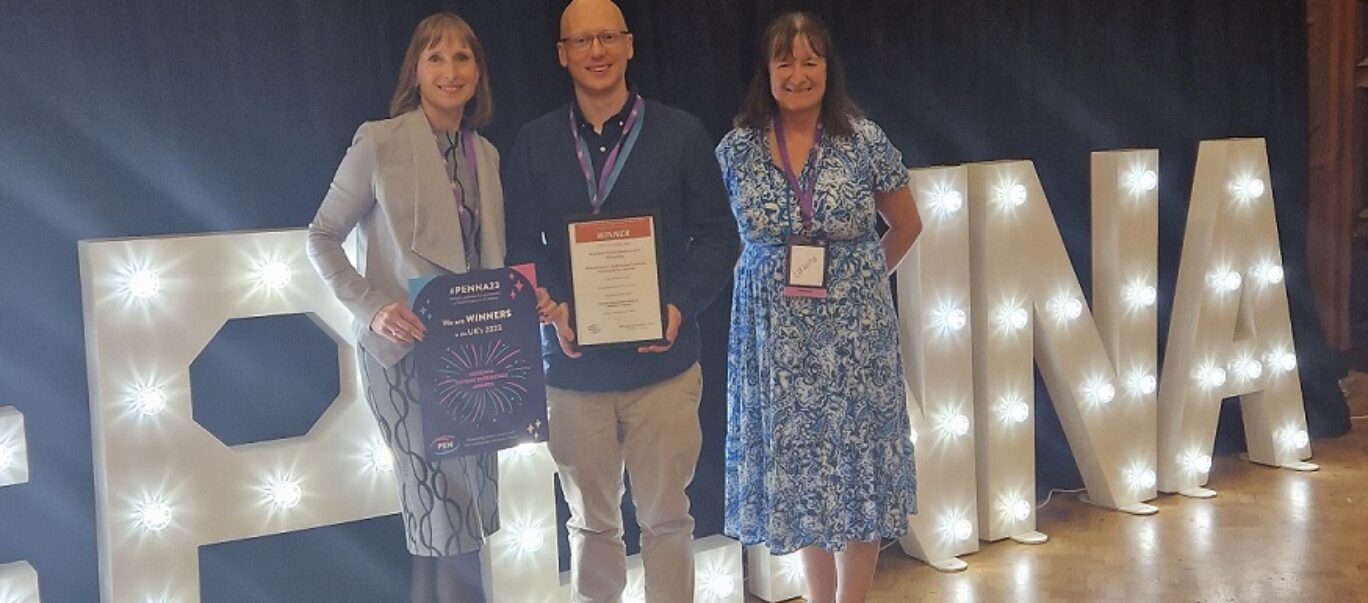 Members of the Experience of Care Network holding up their award and certificate after winning the Strengthening the Foundation award at the Patient Experience Network National Awards 2023.