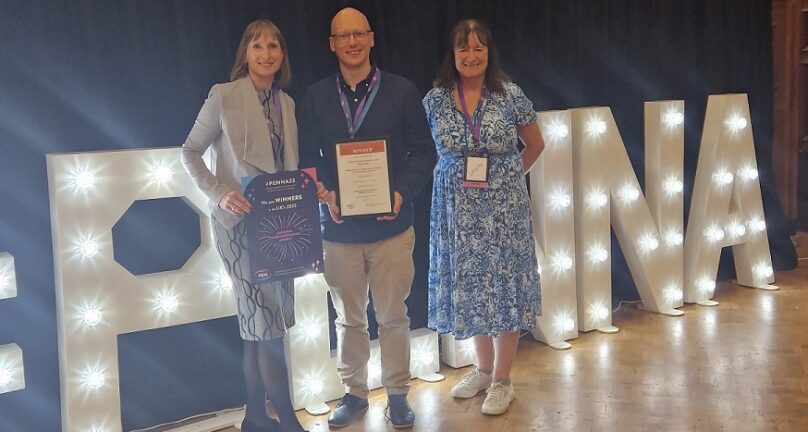 Members of the Experience of Care Network holding up their award and certificate after winning the Strengthening the Foundation award at the Patient Experience Network National Awards 2023.