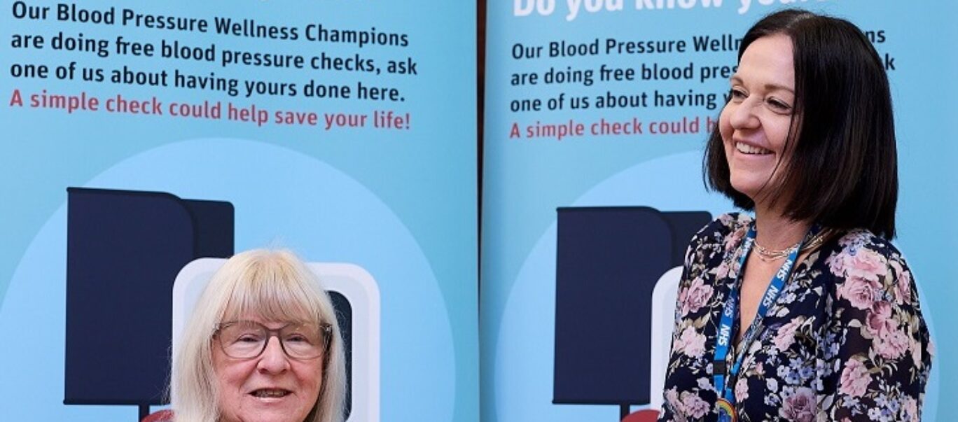 Councillor Maureen Cummings having her blood pressure checked at an event.