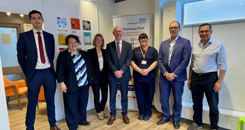 A photograph of David Webb, Chief Pharmaceutical Officer, and representatives from a local pharmacy, Trinity Health Centre, Community Pharmacy West Yorkshire and NHS West Yorkshire Integrated Care Board, on a visit to showcase Pharmacy First.